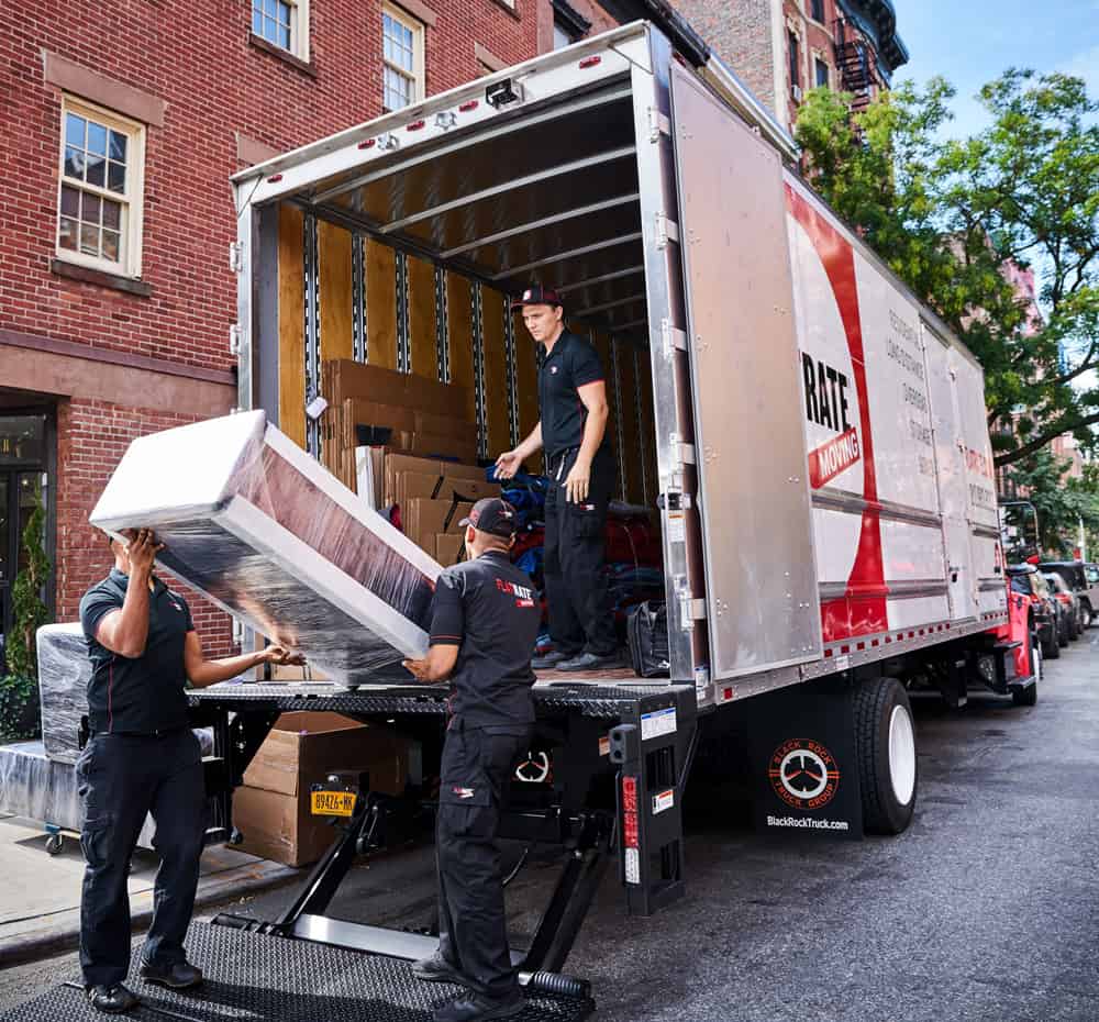 moving company - movers- moving service moving into storage loading truck How Many People Does it Take to Move a Piano?