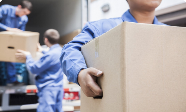 A mover carries a box